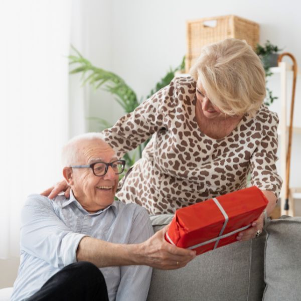 woman giving gift to man